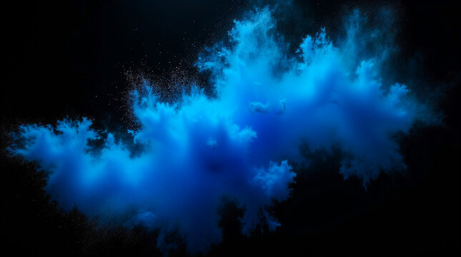 Image shows a central burst of blue powder against a black background.