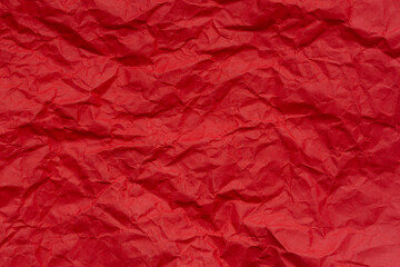 Close-up of red crumpled paper background,texture of crumpled red paper close up. crumpled paper background