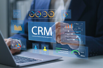 Plakat Customer relationship management software concept. CRM for sales, Sales control and monitoring software with client database. Businessman using laptop with CRM icon on virtual screen.