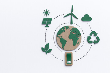 Creative collage representing eco friendly concepts with green and brown elements including globe, wind turbine, and recycling symbols