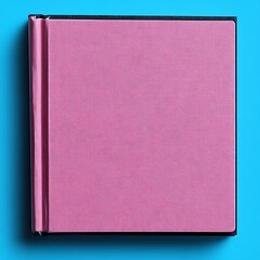 An isolated pink colored book lays on a striking blue background