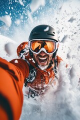 Excited young caucasian male snowboarding in fresh powdered snow.