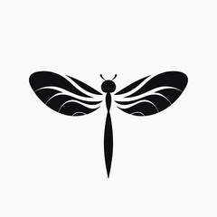 Elegant black dragonfly with intricate wing design as a silhouette