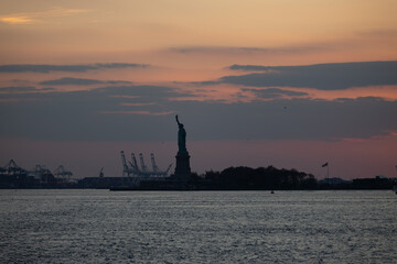 Sunset statue of Liberty New York and Manhattan USA 