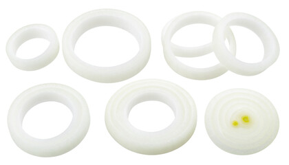 White plastic gaskets in various sizes arranged in a group.