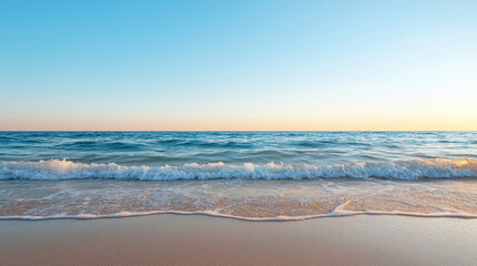 Serene ocean view with gentle waves lapping at sandy shore under clear blue sky. tranquil atmosphere evokes sense of peace and relaxation