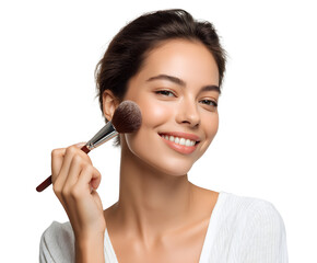 A smiling woman is applying blush to her cheek with a makeup brush, looking radiant.