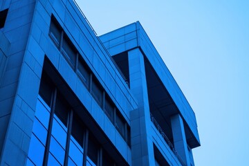 Modern architectural design of a building with blue tones and clear sky