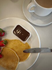 coffee and pancake with strawberry