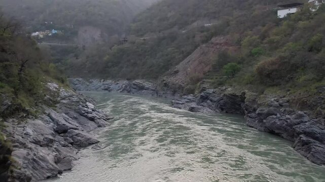 Drone View of Rudraprayag Sangam &ndash; Aerial Shot of the Sacred Confluence of Alaknanda and Mandakini Rivers Amidst Himalayan Landscape in Uttarakhand, India