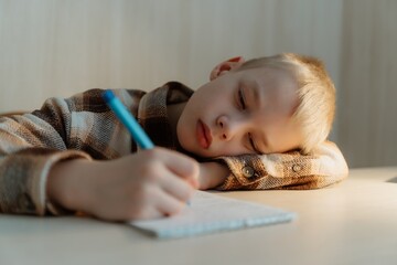 An 8-year-old boy is doing his school homework at home, concentrating on writing in a notebook. Focused and determined, he learns and practices new skills, developing his knowledge in a cozy study