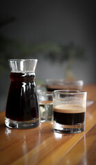 A glass of espresso, manual brew coffee and pour-over coffee (traditional)