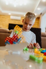 Fototapeta premium A sister and brother enjoy a fun moment playing board games at home, celebrating family bonding and love. The cozy scene captures the joy of sibling relationships and shared activities