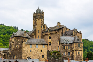 Castle of Estaing on a cloudy day from the banks of the Lot