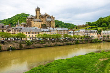 Castle of Estaing on a cloudy day from the banks of the Lot