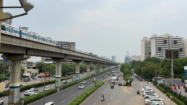 Drone Shot of DLF Cyber City Gurgaon &ndash; Aerial View of Iconic IT Hub with Glass Towers, Office Buildings, Skywalk, Metro Line, and Modern Infrastructure in Gurugram, India