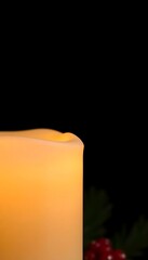 lit candle sitting on top of a table