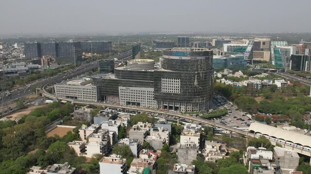 Drone Shot of DLF Cyber City Gurgaon &ndash; Aerial View of Iconic IT Hub with Glass Towers, Office Buildings, Skywalk, Metro Line, and Modern Infrastructure in Gurugram, India