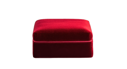 A crimson velvet jewelry box, square-shaped with a cushioned top, sits against a black background