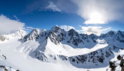 Dawn over the snow capped mountains. Snowy mountain peak at dawn. Sunrise in mountain 