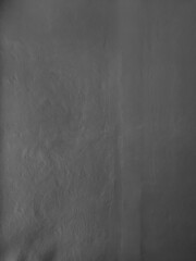 Dark Textured Surface with Subtle Variations in Tone and Depth for Artistic Representations