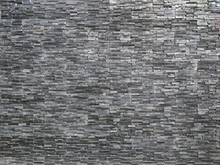 Obraz premium Textured Wall of Slate Tiles in Various Shades of Gray for Modern Design and Architecture