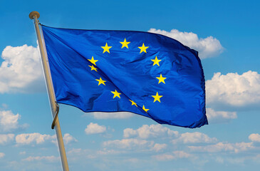European Union flag. Blue banner with yellow stars	