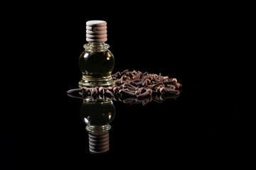 Clove Grains and Medicinal Clove Oil In a Bottle