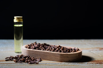 Clove Grains and Medicinal Clove Oil In a Bottle