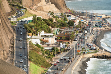 Heavy traffic  during daylight  with many cars on the coastal cliff side street in Lima © Cristi