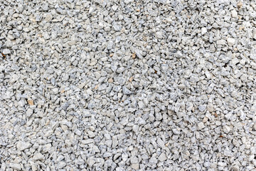 Abundant gray gravel stones texture background for construction and landscaping