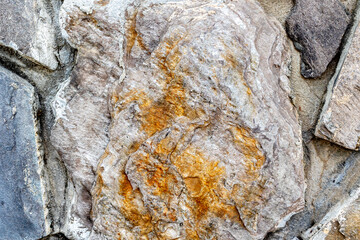 Close-up of natural stone texture showing detailed patterns and earthy tones