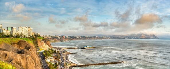 Panoramic view of the Miraflores coastline in Lima, Peru with the dramatic cliffs and the highway along Pacific Ocean.