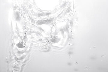Clear Water Splash with Bubbles on Light Background for Design Use