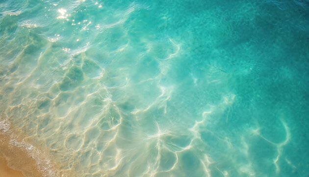 Aerial photo of ocean water. Clear, transparent turquoise water with sandy beach bottom. Calm sea waves, water surface texture, sun reflections create serene, fresh mood. Beach, vacation, travel