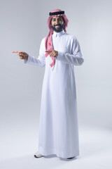 A collection of images of an Arab man wearing traditional Saudi thobe and shemagh, reflecting modern lifestyle activities like using technology, shopping, and standing confidently in a studio setting.
