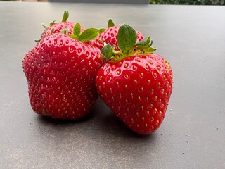 strawberries on gray background 