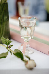 glass of water on table with wrapping paper for bouquets and flowers