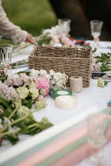 table with flowers and supplies for making bouquets