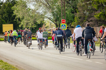 Fototapeta premium Group of cyclists on city road, street, asphalt