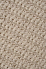 texture of knitted light brown sweater, close-up texture of beige knitted fabric, macro texture of tan knitted woolen clothes	
