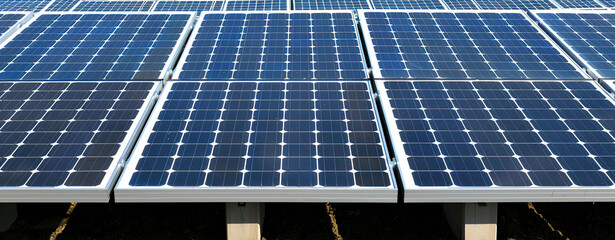 Solar panels in a field, a clean energy source for a sustainable future.