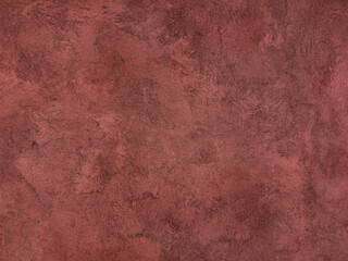 Decorative red concrete washed paint on a wall or panel. Exposed red concrete paint with random...