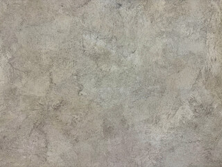 Decorative grey concrete washed paint on a wall or panel. Exposed concrete paint with random brush...