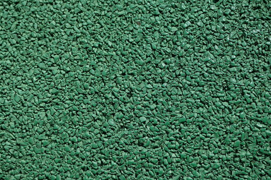 Green rubber gym floor texture Running track surface green Outdoor fitness zone flooring Sports ground rubber texture Safety rubber coating macro