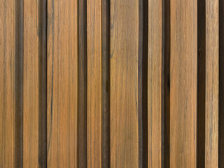 Close up of natural wood fluted panel or striped panel, seamless background texture.