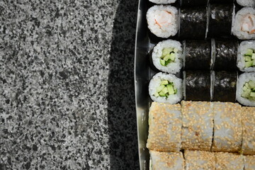 Sushi Rolls in Takeout Box, Street Food Sushi in Paper Box – Close View, Takeaway Sushi Rolls –...