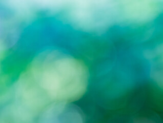 Dreamy blue green zen blurred background of various soft circles of confusion of blues and greens for any creative project. Create a lovely ethereal, serene and tranquil backdrop from nature's colors.