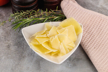 Parmesan cheese slices in the bowl