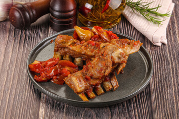 Baked lamb ribs with vegetables